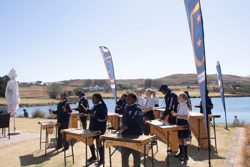 The Prep Marimba Band entertain the golfers ahead of the tee off time at registration